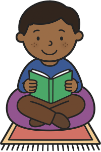boy sat on beanbag reading a book